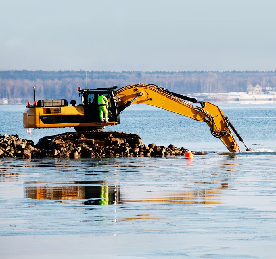 bulldozer dredging in the sea