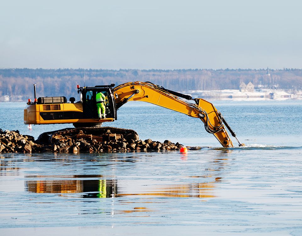bulldozer dredging in the sea